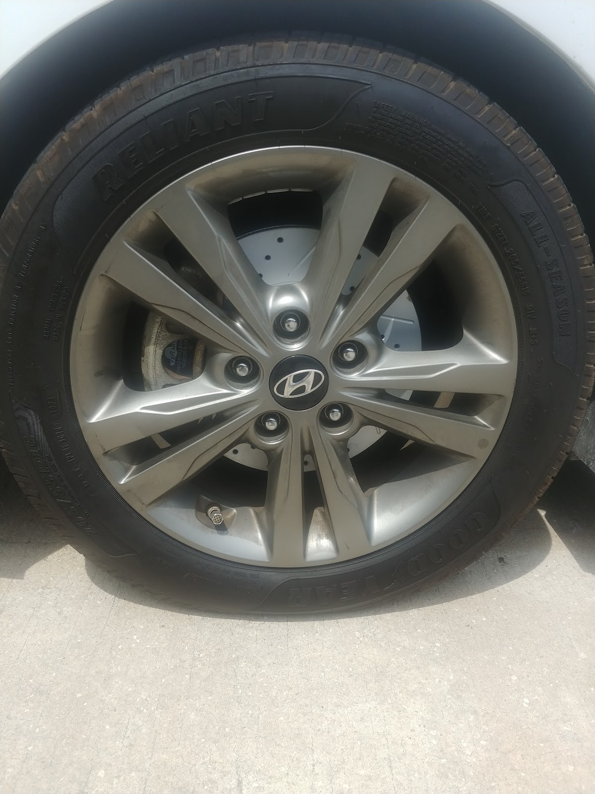 Mobile mechanic working on vehicle